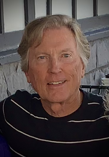 Douglas Waggoner, artist and founder of Naturally Fallen Timber, smiling in a head-and-shoulders portrait