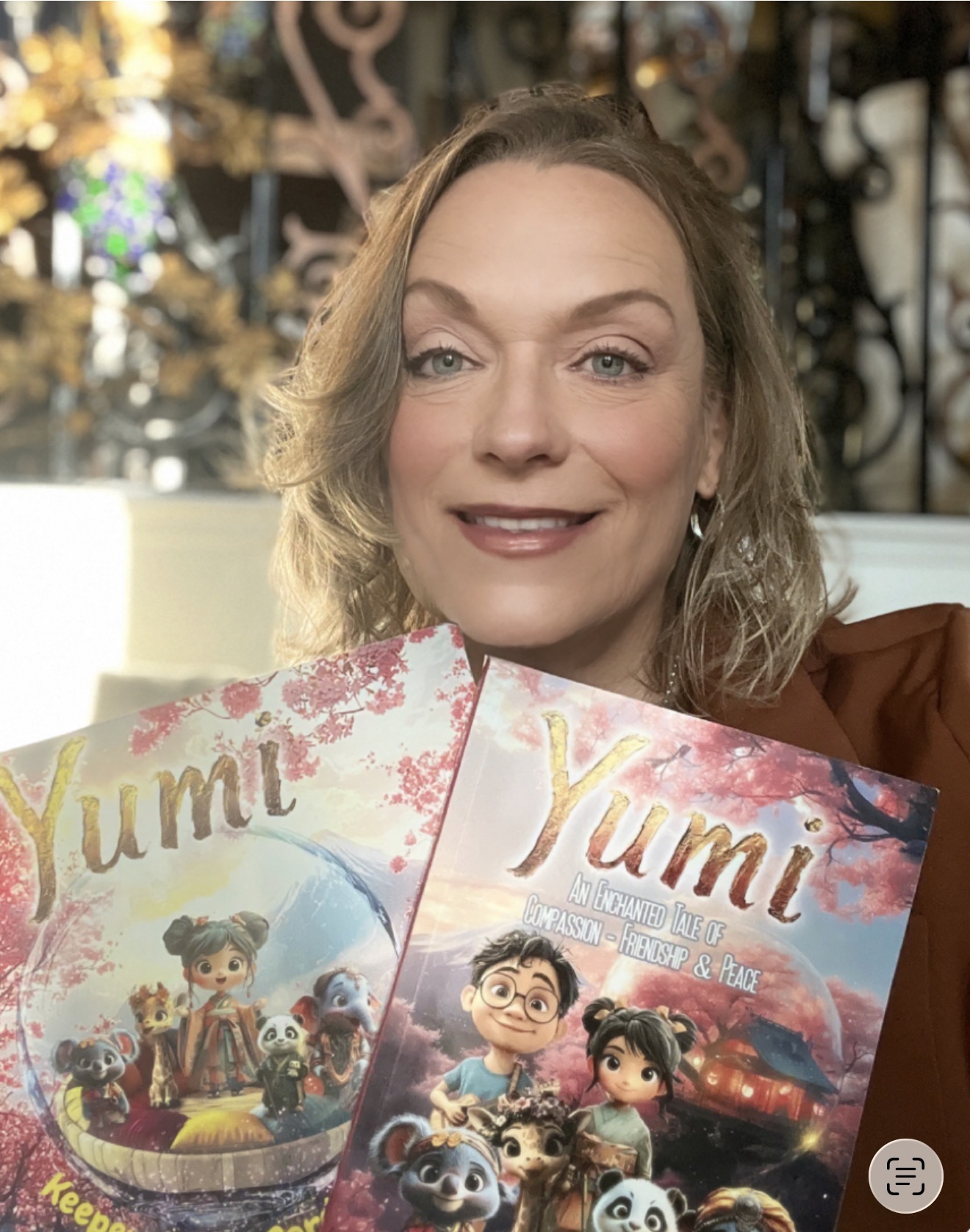 Tess Cacciatore holding the Yumi's Universe books